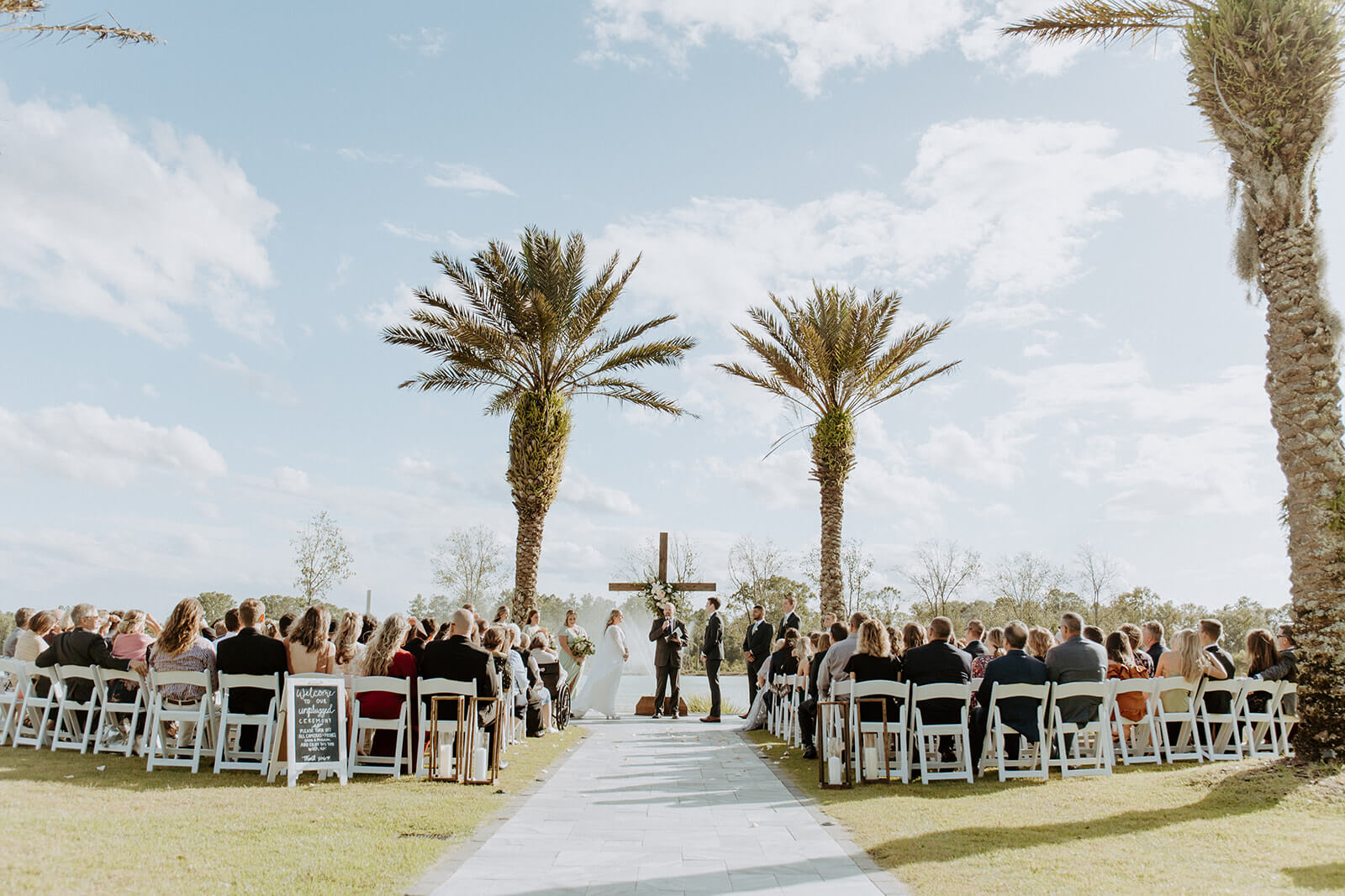bride and groom stand at wedding alter at the barn at cottonwood ranch