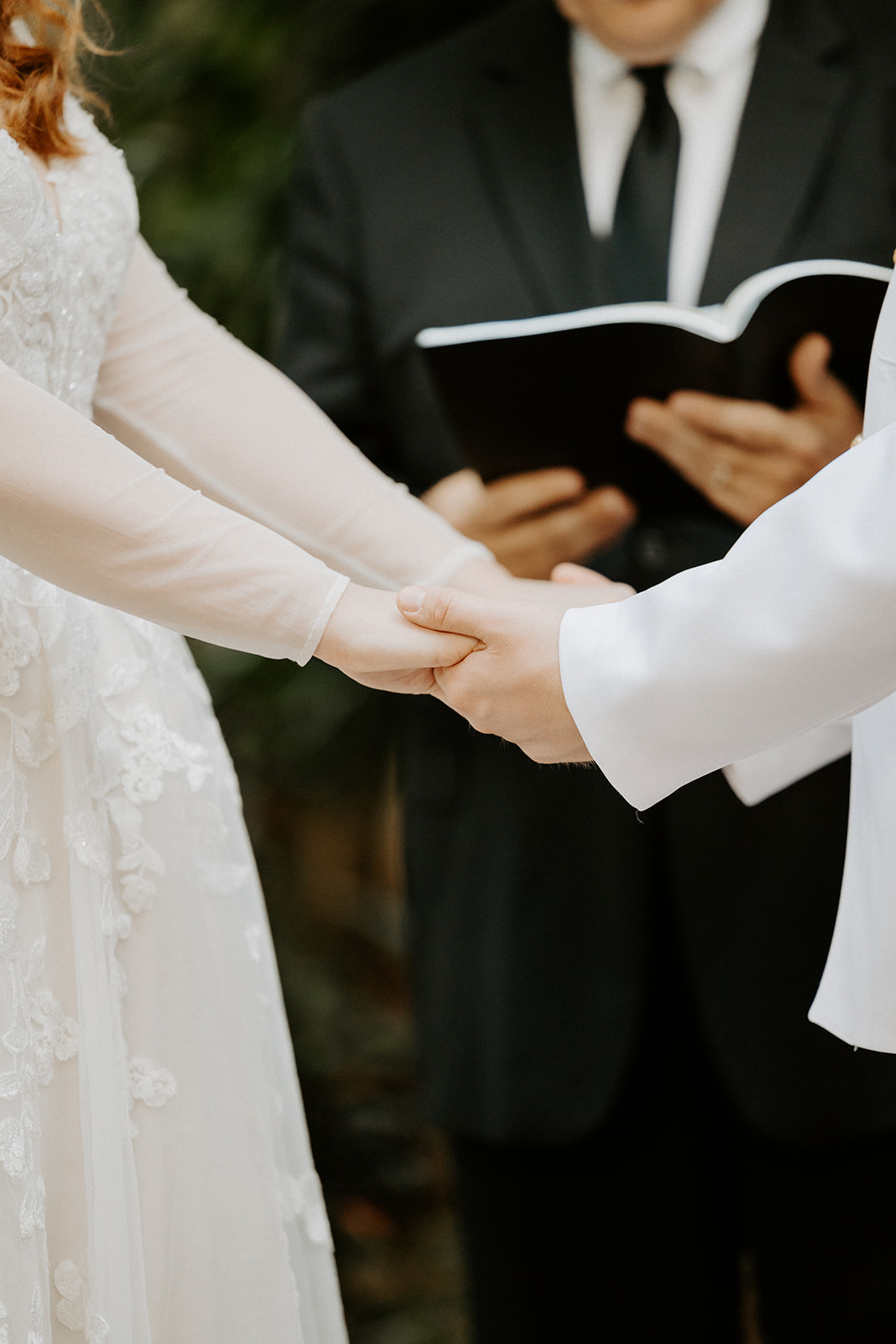 bride and groom holding hands at azaleana manor wedding