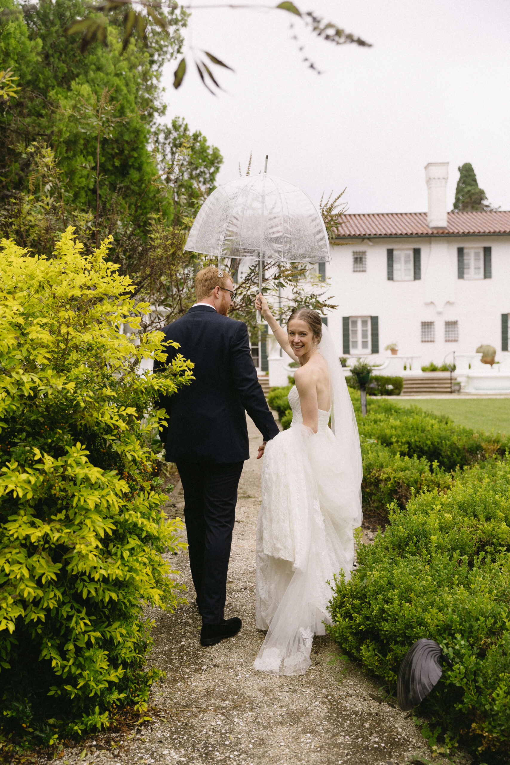 bride walks and looks back with groom