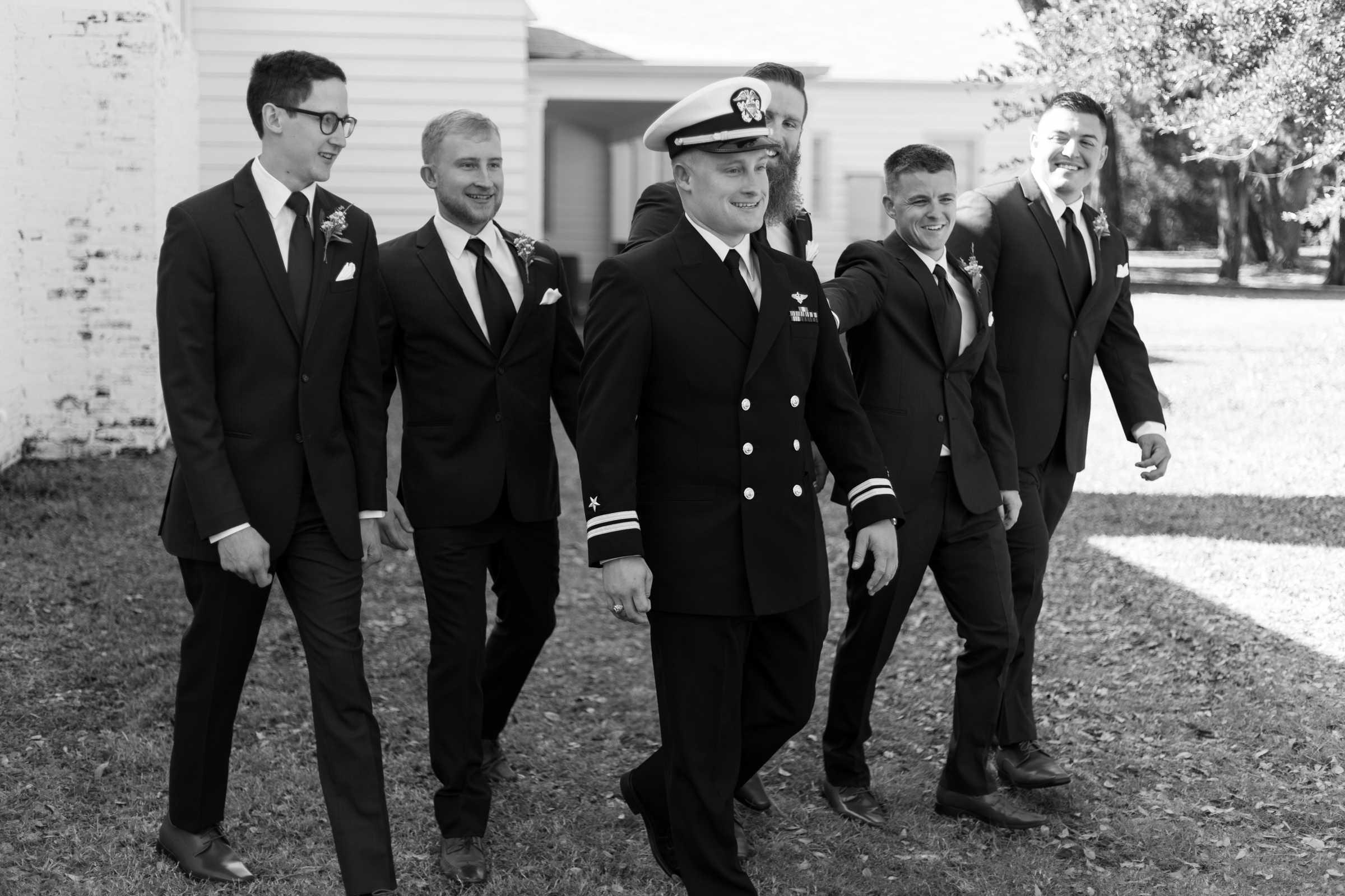 groom walks with groomsmen at jacksonville fl wedding venue