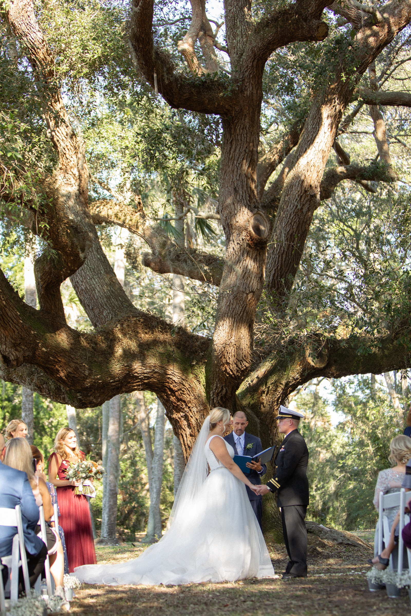 bride and groom stand at alter of ribault club a jacksonville fl wedding venue