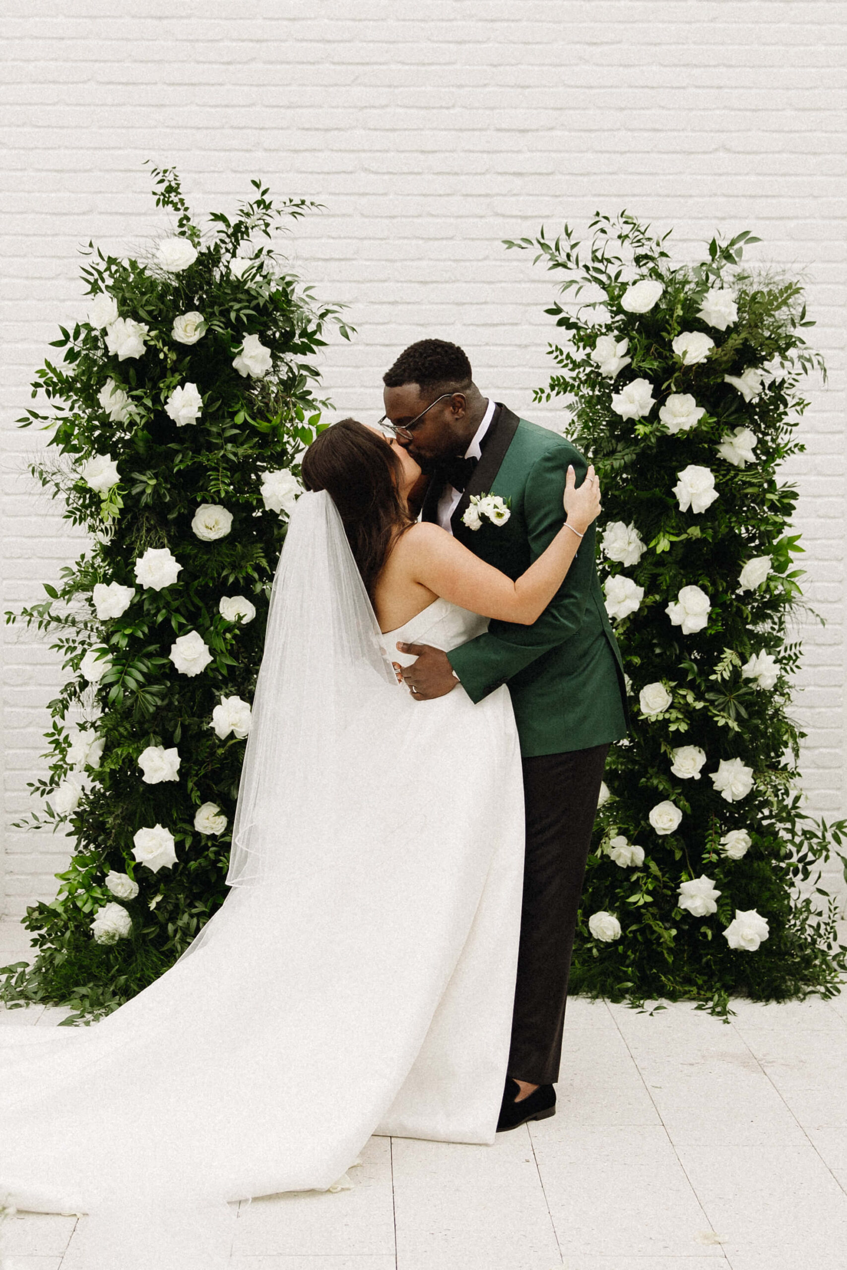 bride and groom kiss at altar at jacksonville fl wedding venue