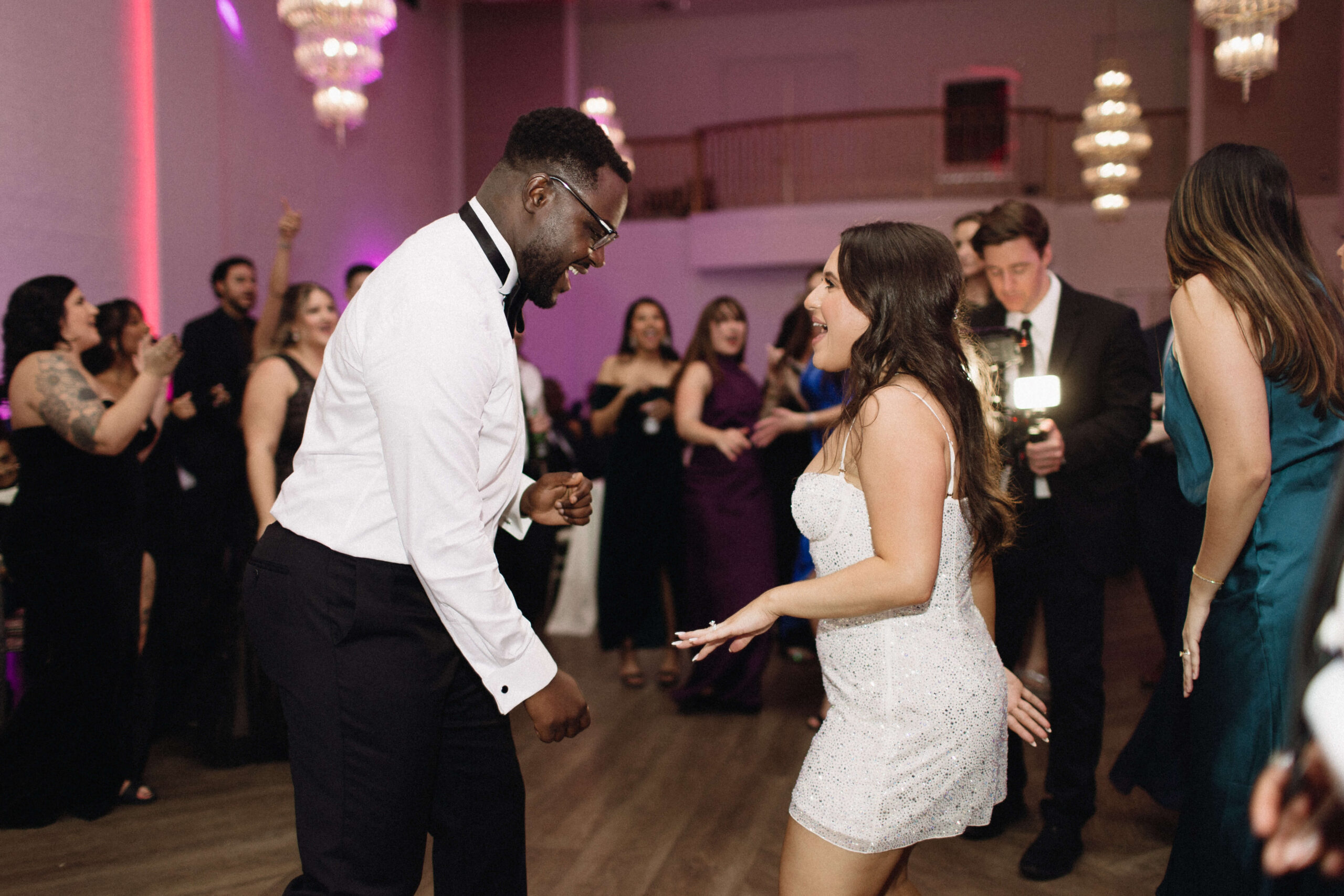 bride and groom dance together at wedding reception