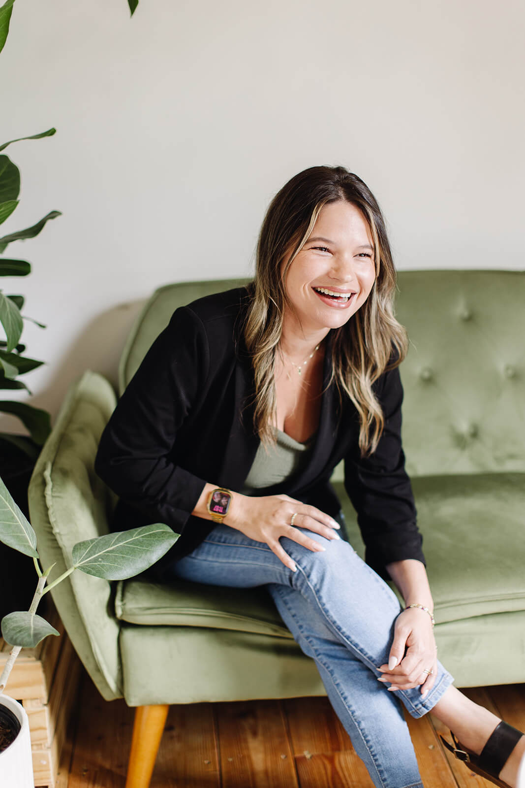 woman laughing on green chair