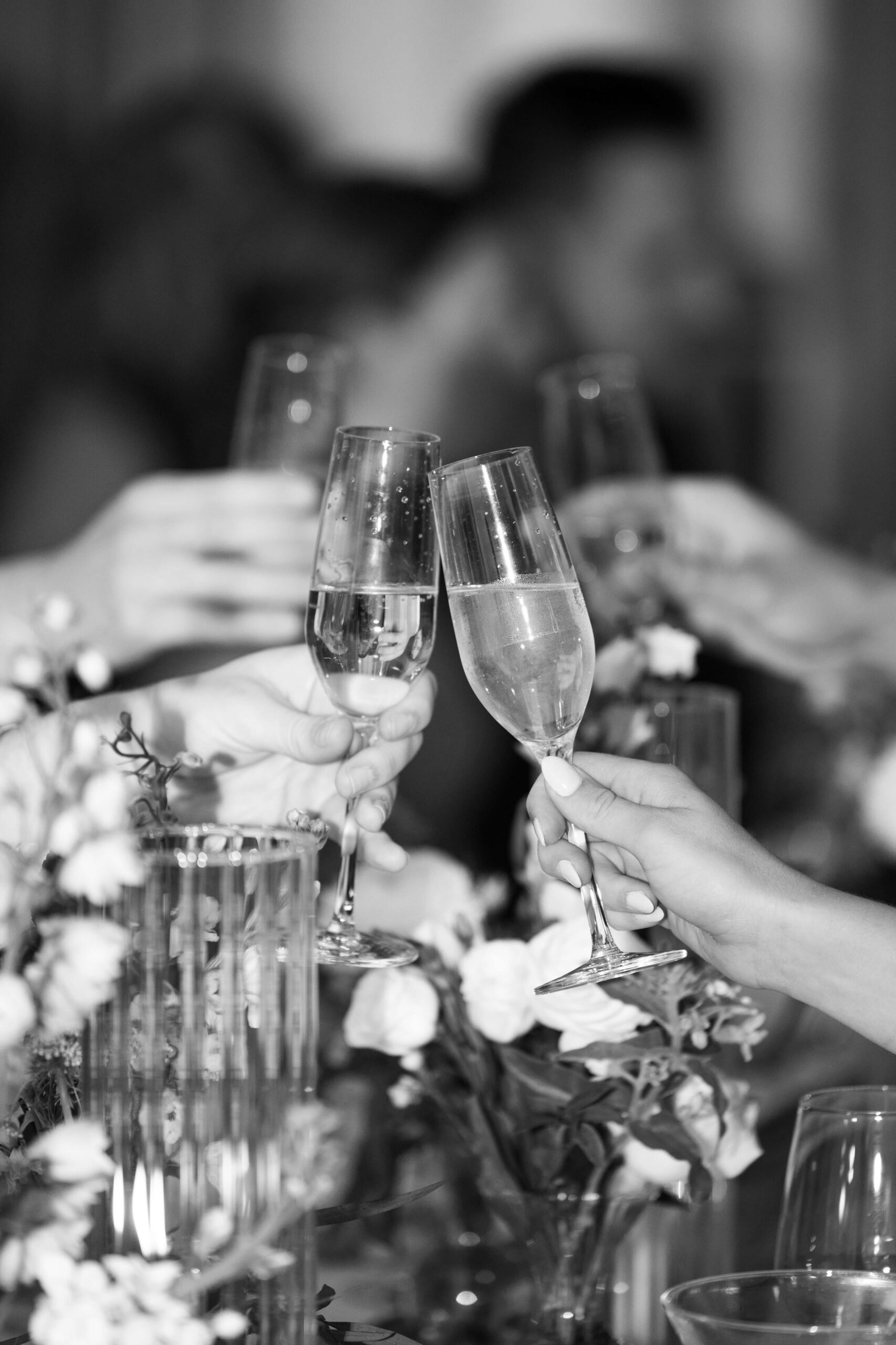 group of people cheersing their champagne glasses