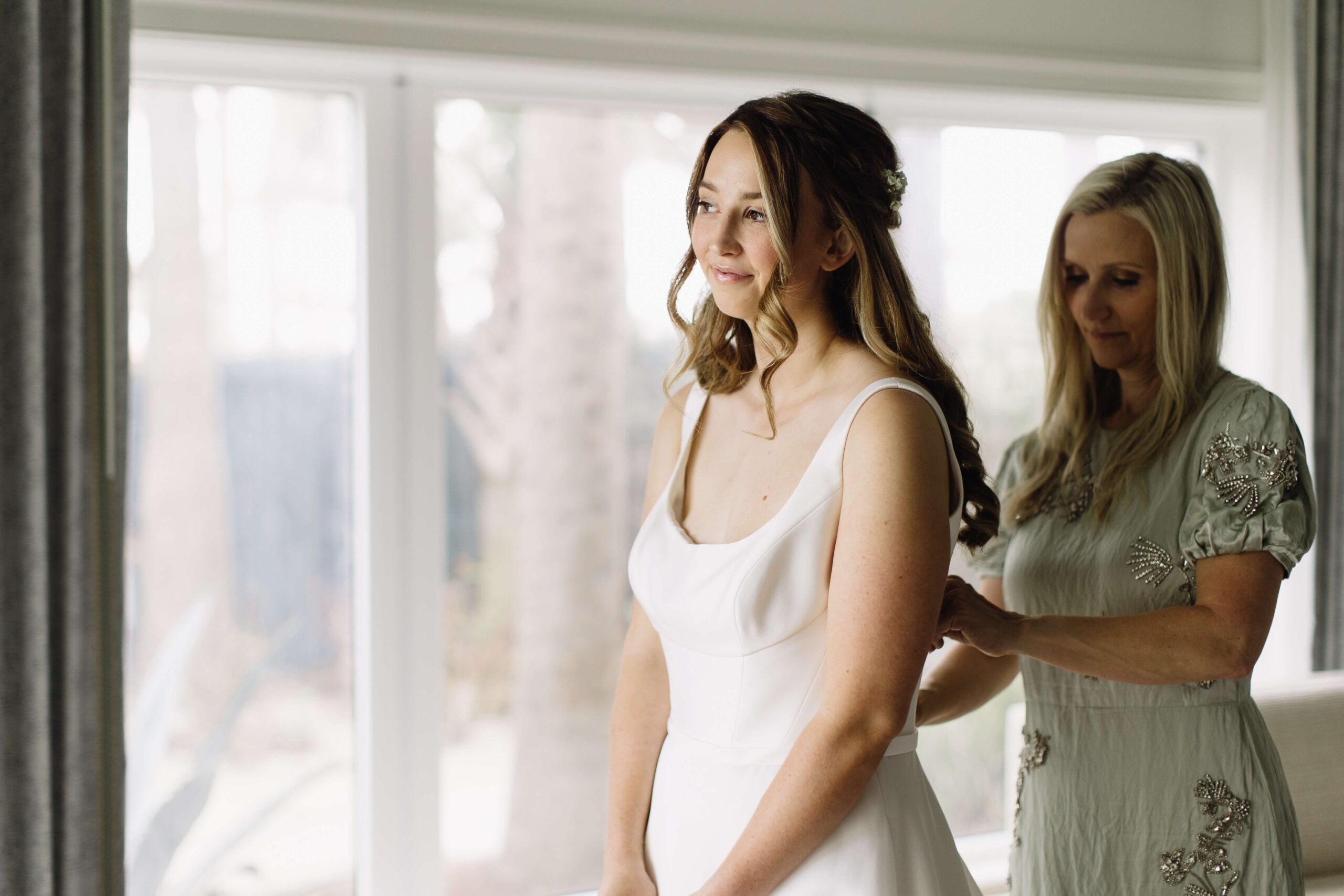 close up image of bride looking out window
