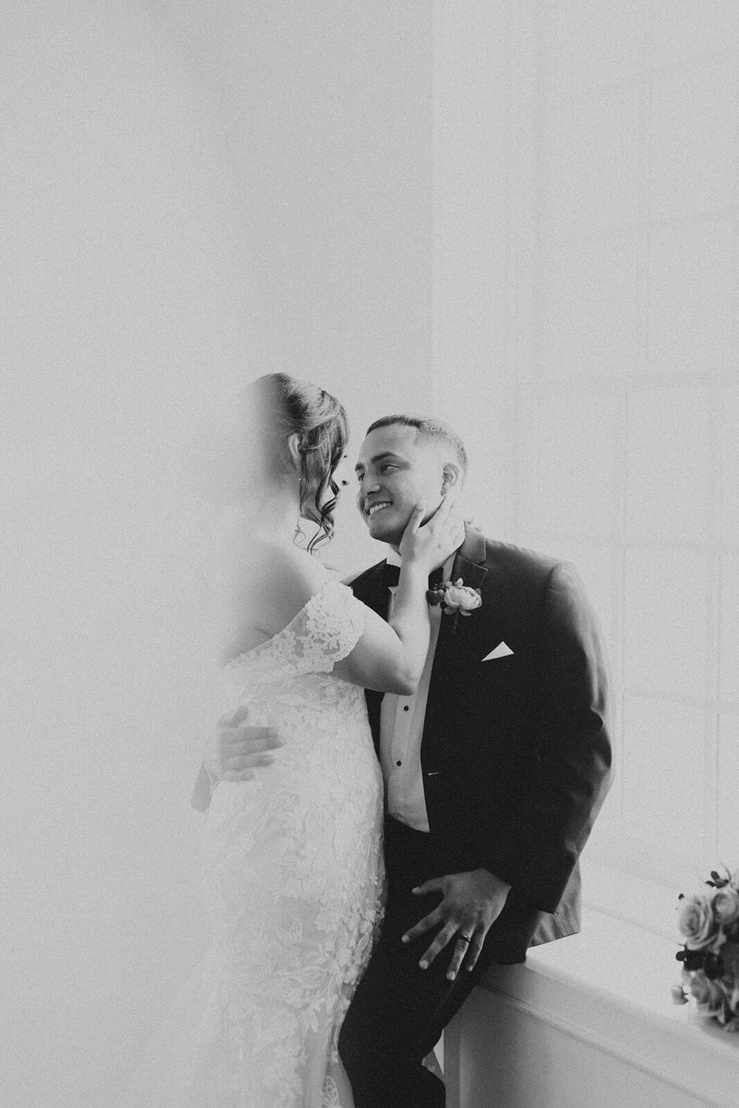 bride and groom look at each other