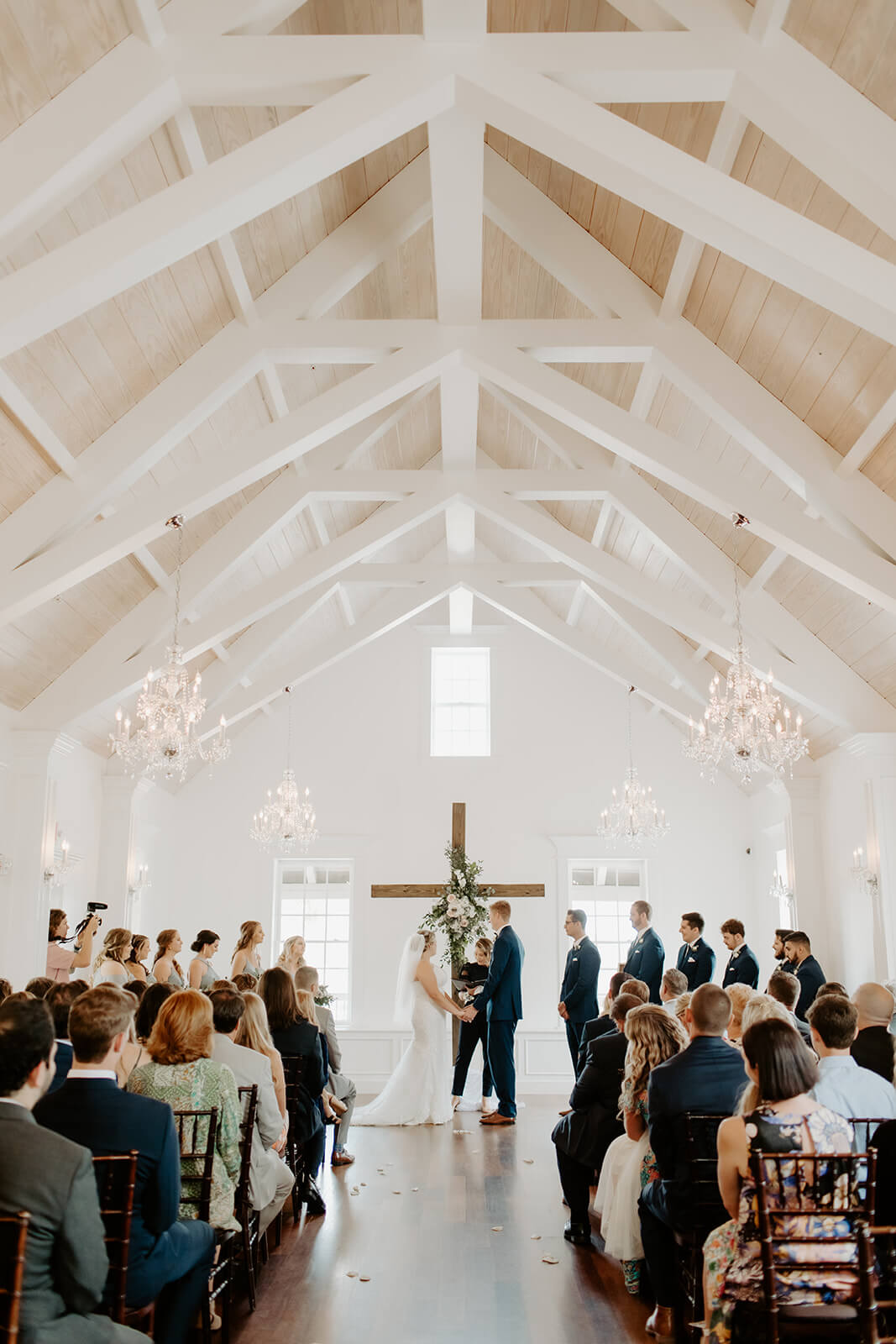 bride and groom stand together at wedding alter in the villa blanca at the white room in st augustine