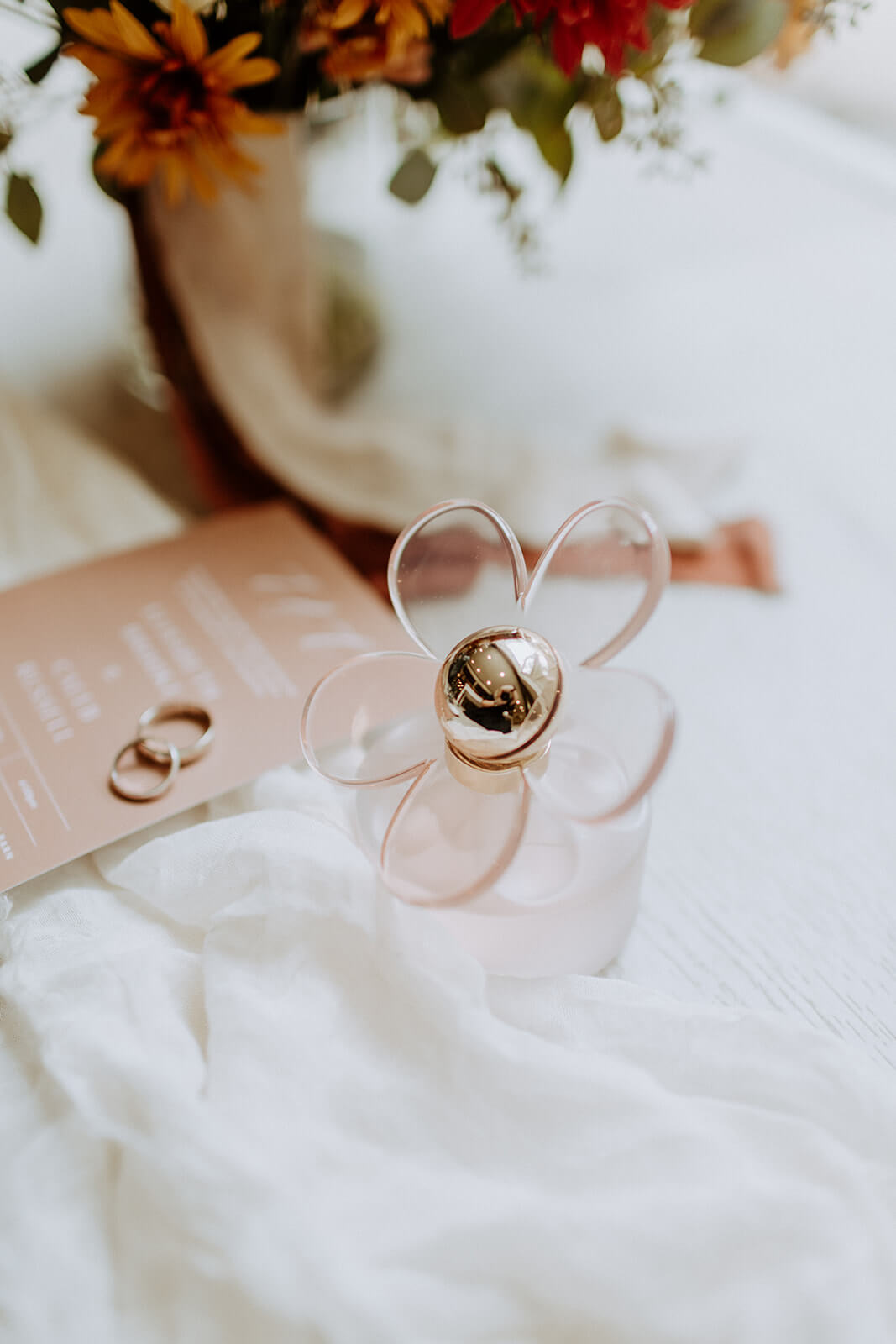 close up detail of flower shaped perfume at chandler oaks wedding