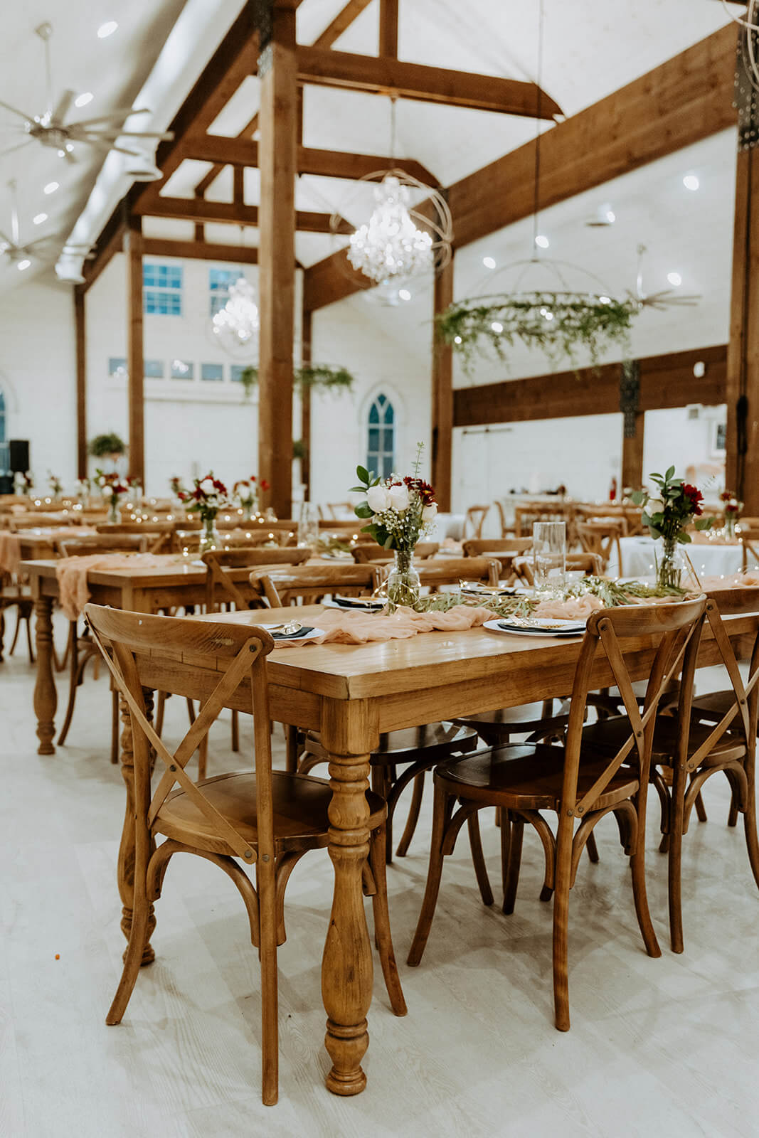 reception table details in all white barn wedding venue in jacksonville fl